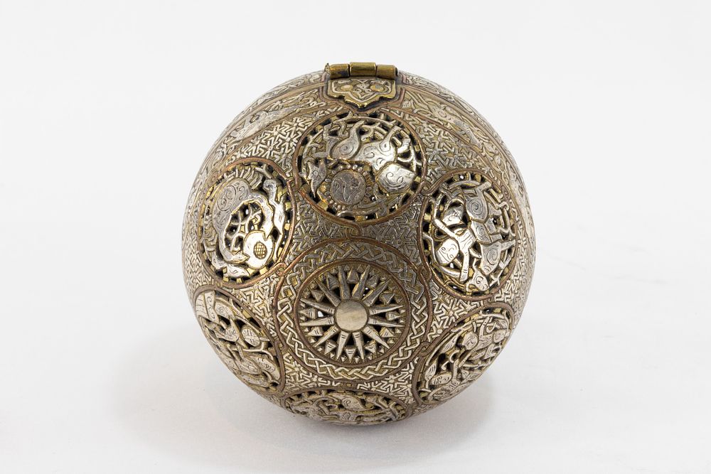 Lot 213: An Islamic Bronze Spherical Incense Burner Decorated with...