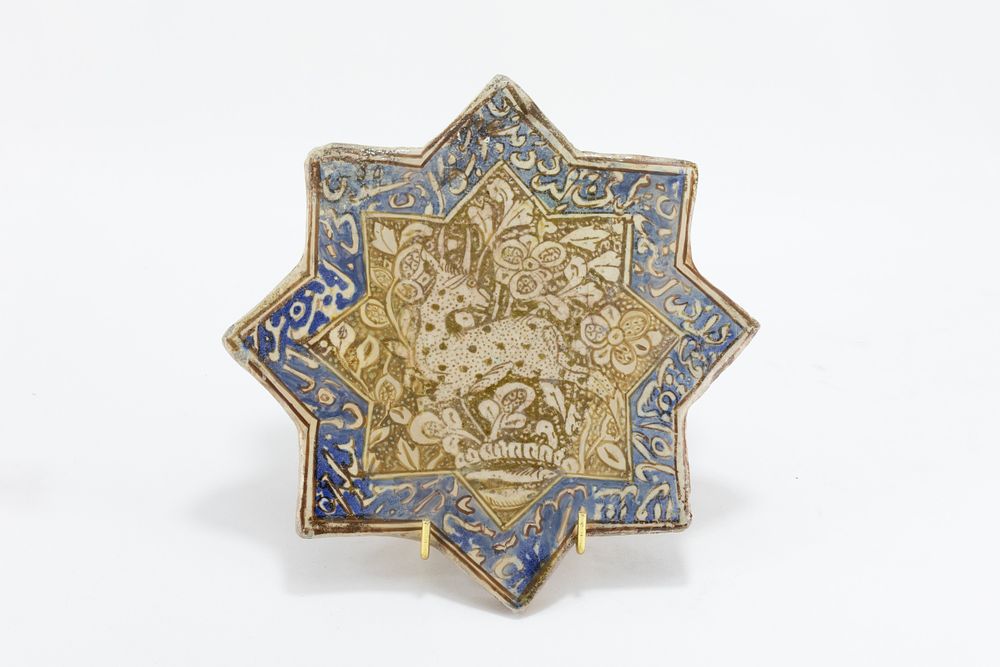 Lot 219: An Islamic Kashan Moulded Tile in the Shape...
