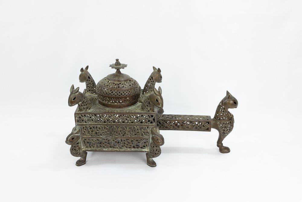 Lot 222: An Islamic Bronze Incense Burner Decorated with Lion...