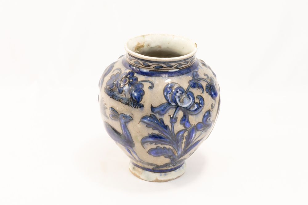 Lot 224: An Islamic Persian Safavid Pottery Urn Decorated with...