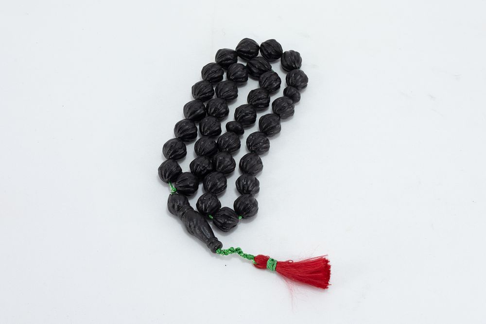 Lot 228: An Islamic Ottoman Black Desert Amber Prayer Beads...