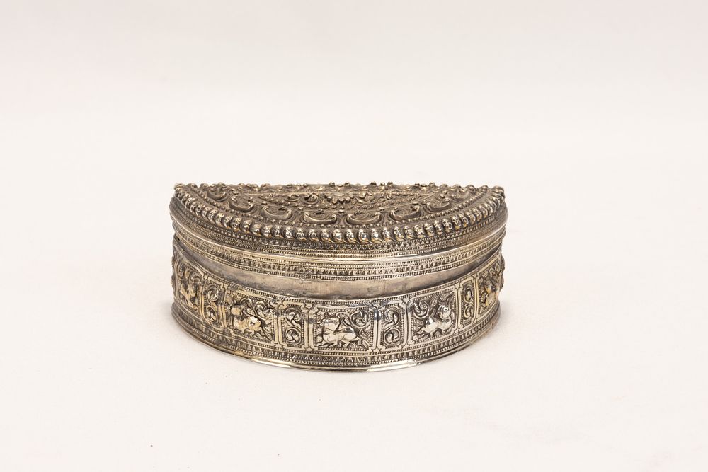 Lot 260: A Burmese Silver Crescent Moon Betel Box Decorated...