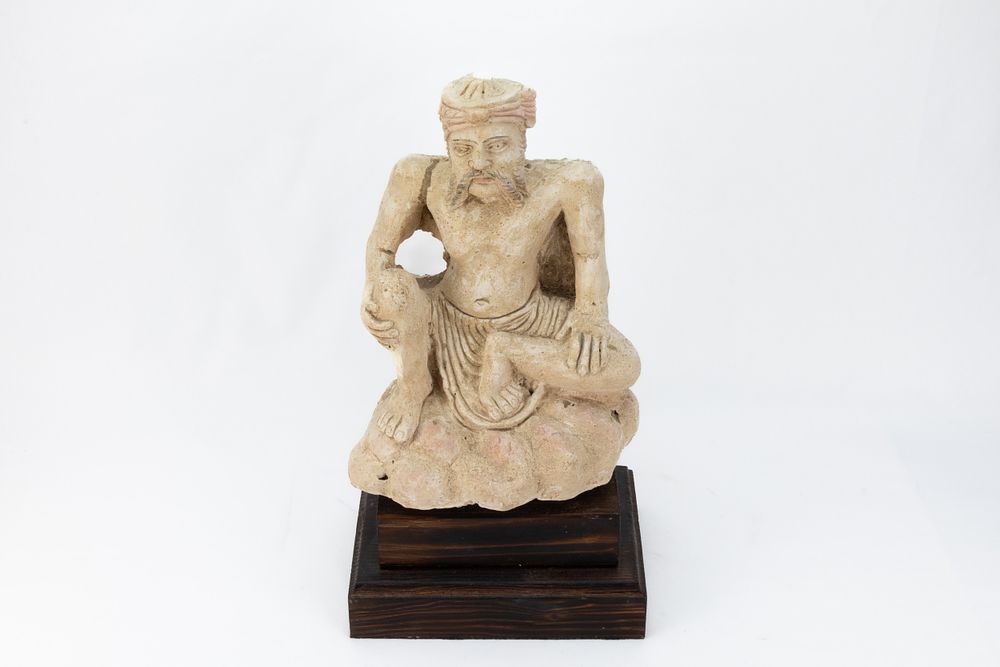 Lot 284: A Buddhist Plaster Seated Figure of a Man...