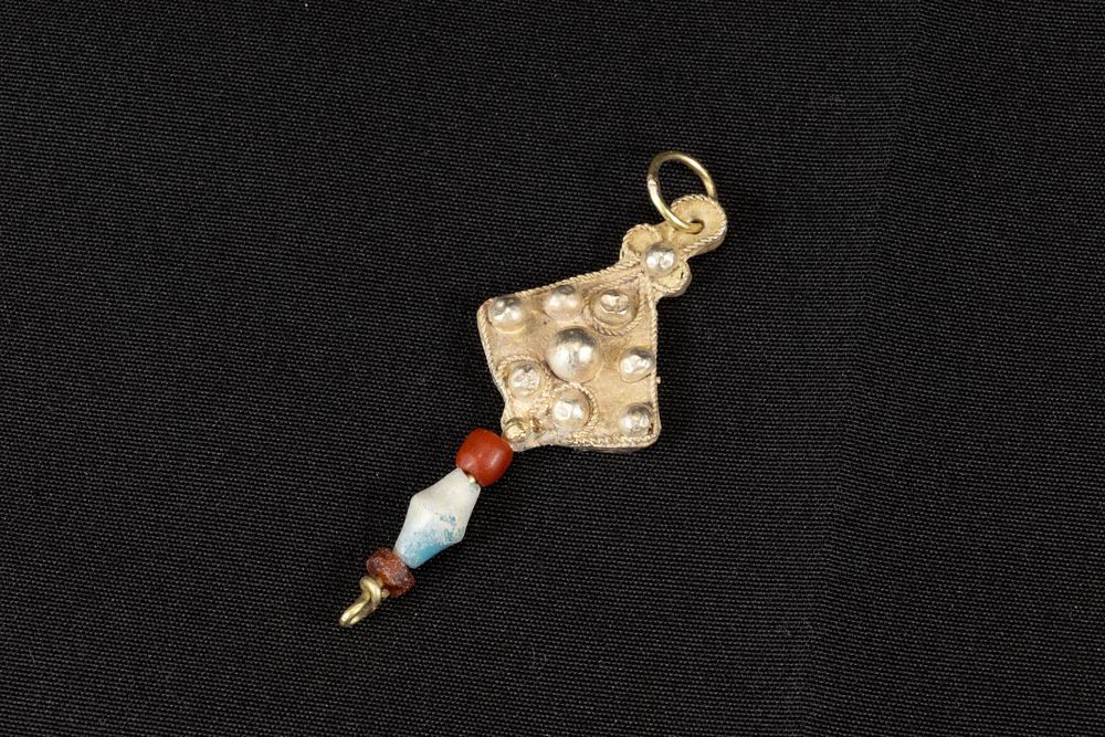 Lot 313: A Bactrian Electrum Pendant with Glass Beads in...