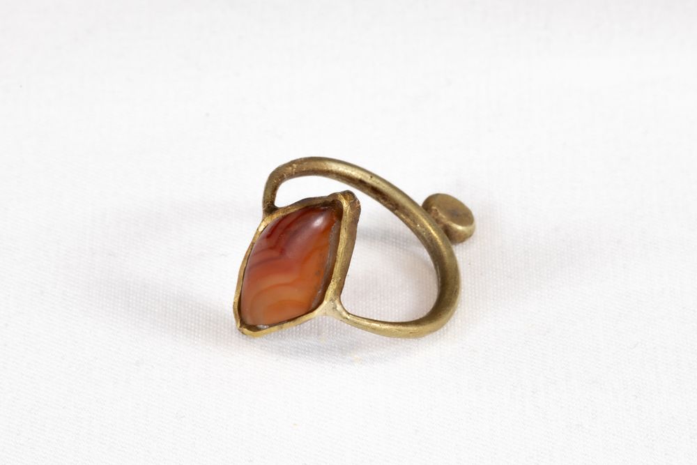 Lot 322: A Western Asiatic Gold Ring with a Rhombic...