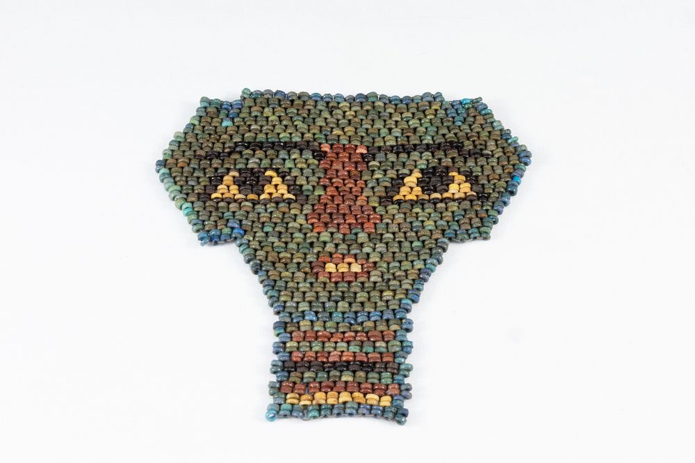 Lot 341: An Ancient Egyptian Faience, Beaded Mummy Mask from...
