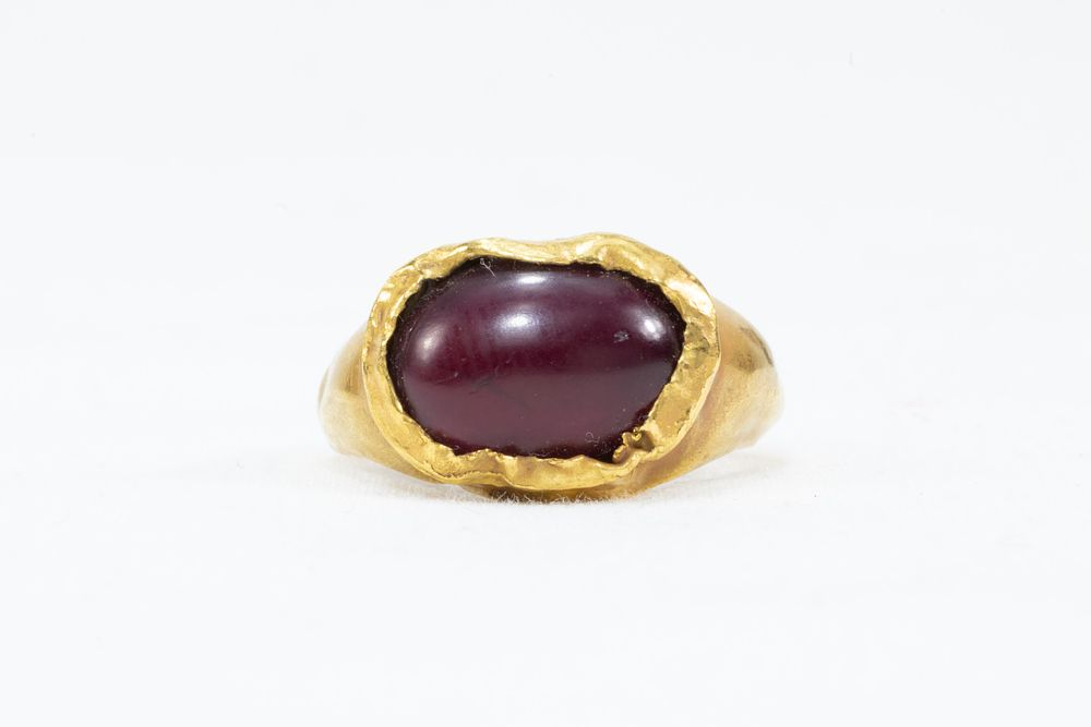 Lot 23: A Roman Gold Ring with a Garnet Stone...