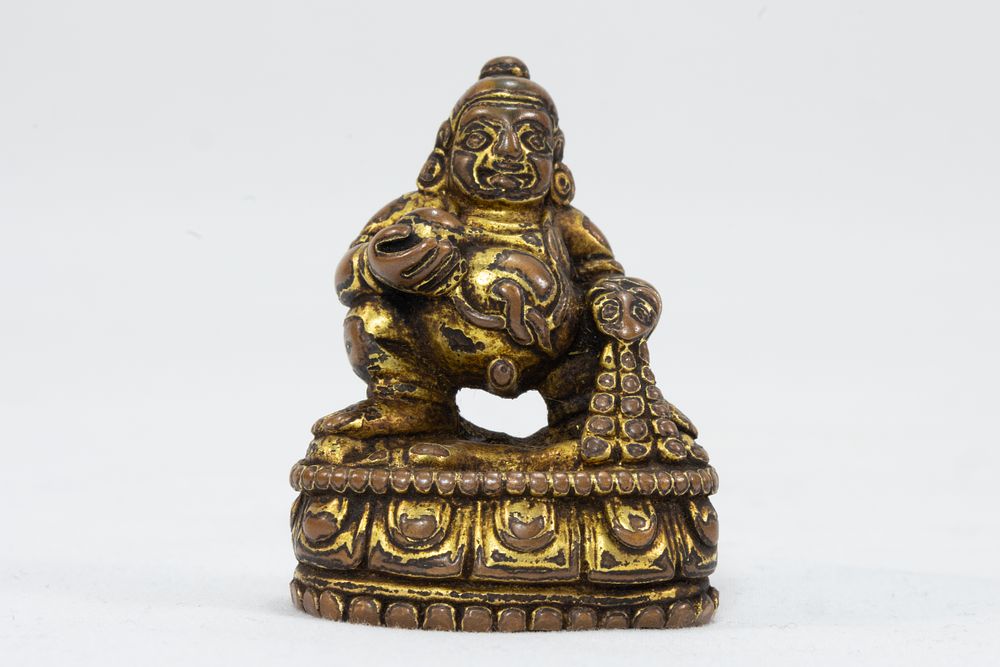 Lot 46: A Tibetan Bronze Gold Gilt Figure of Jambhala...