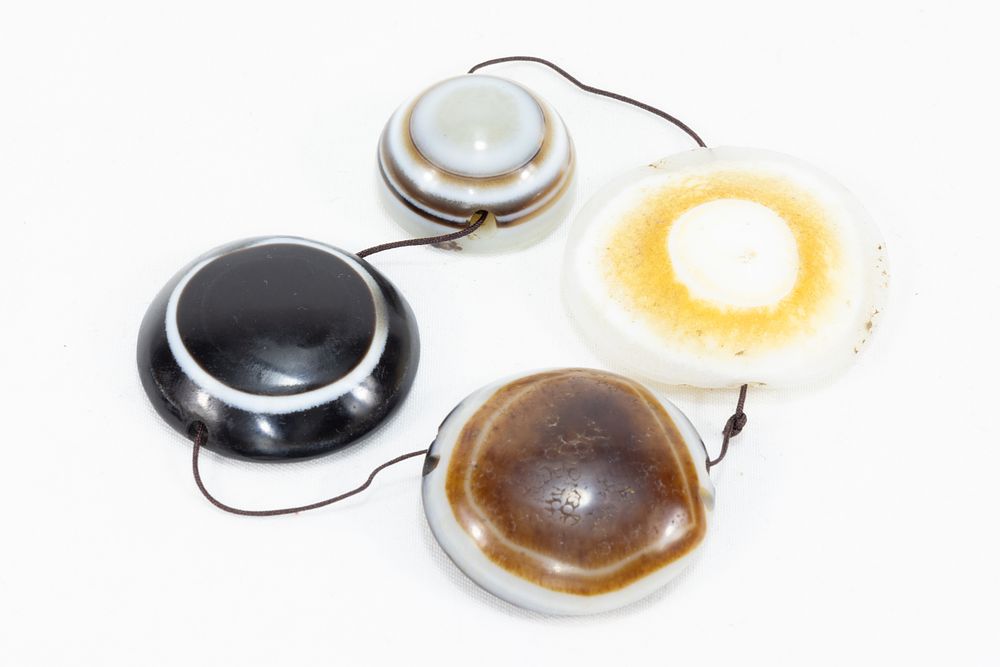 Lot 53: A Lot of 4 Tibetan Agate Dzi Eye...