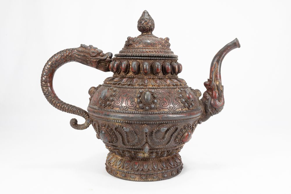 Lot 60: A Large Tibetan Bronze Teapot with the Handle...