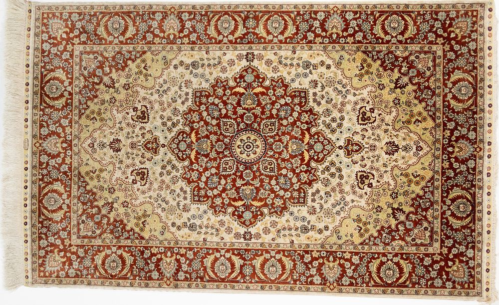 Lot 76: An Islamic Turkish Silk Carpet with Silk Tassels...
