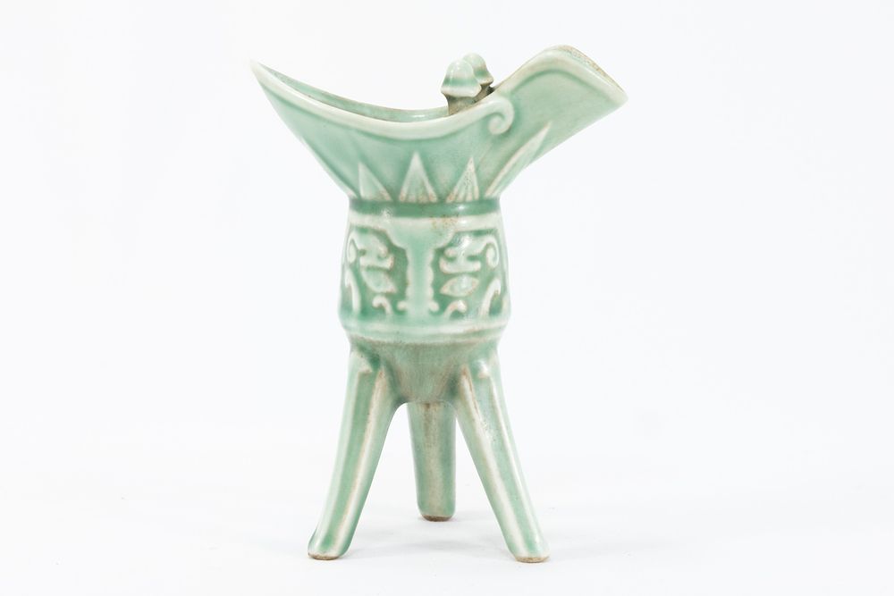 Lot 83: A Chinese Green Ceramic Oil Lamp.