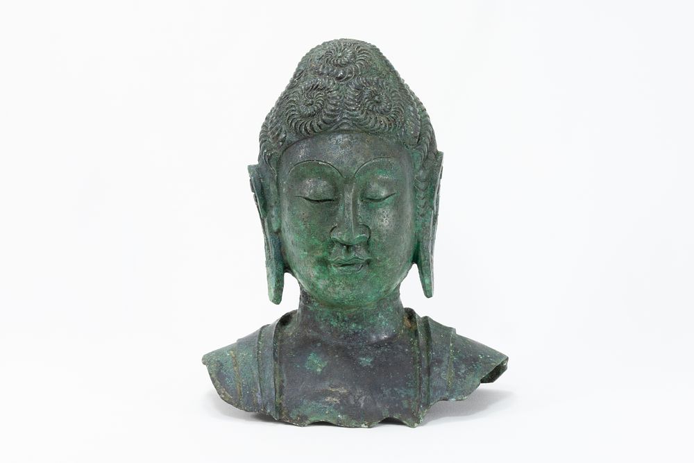 Lot 87: A Chinese Tibetan Bronze Buddha Head with Green...
