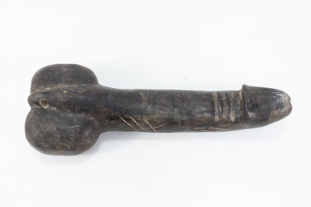 Lot 92: A Chinese Tibetan Carved Stone Phallus.