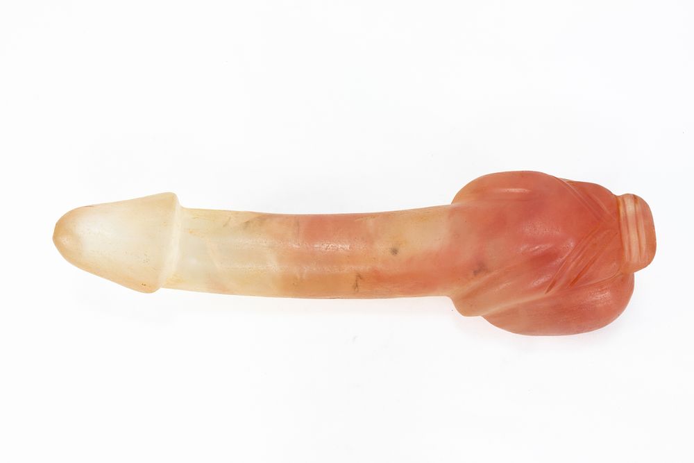 Lot 93: A Chinese Tibetan Carved Rock Crystal Phallus.