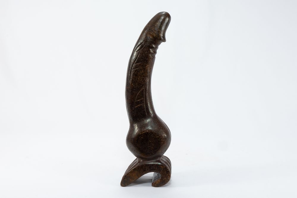 Lot 94: A Chinese Tibetan Carved Stone Phallus.
