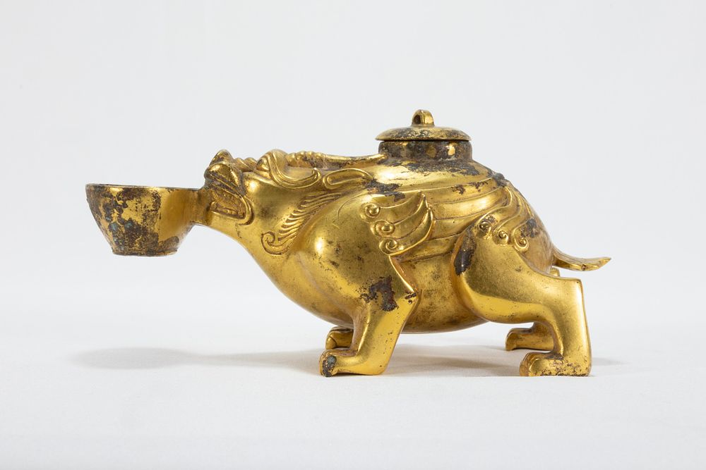 Lot 113: A Chinese Bronze Gilted Oil Lamp in the...