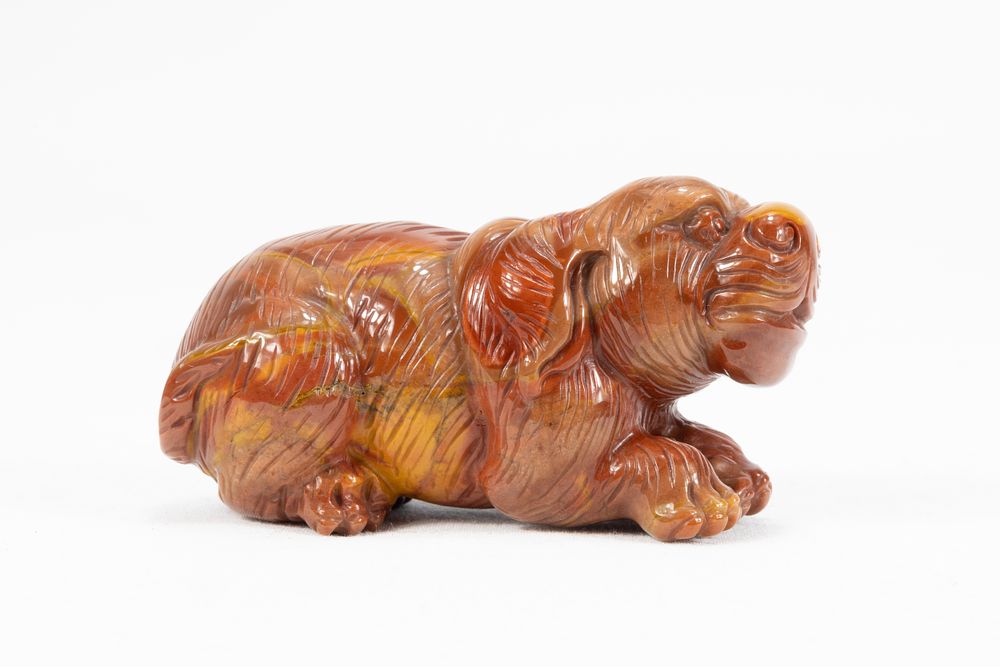 Lot 118: A Chinese Hand-Carved Agate Figure of a Dog.