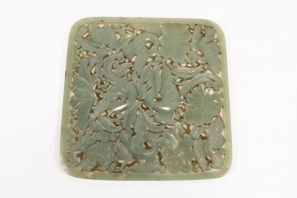 Lot 140: A Chinese Green Carved Jade Plaque Depicting Floral...
