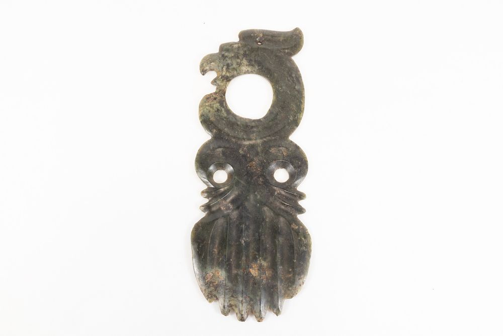 Lot 141: A Chinese Green Carved Jade Flat Anthropomorphic Bird...