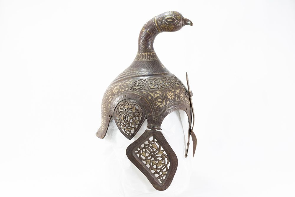 Lot 148: An Indian Islamic Brass Helmet with Openwork in...