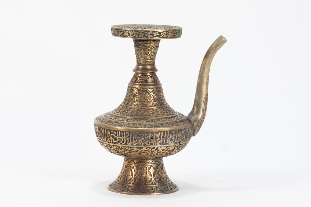 Lot 153: An Islamic Persian Brass Water Jug with intricate...