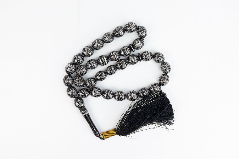 Lot 159: An Islamic Black Prayer Beads Tasbih with White...