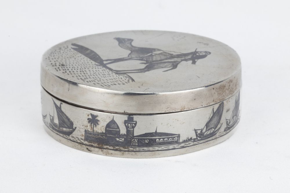 Lot 161: An Islamic Iraqi Niello-Silver Pill Box.