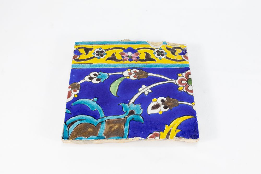 Lot 176: An Islamic Zand Blue Ceramic Tile from the...