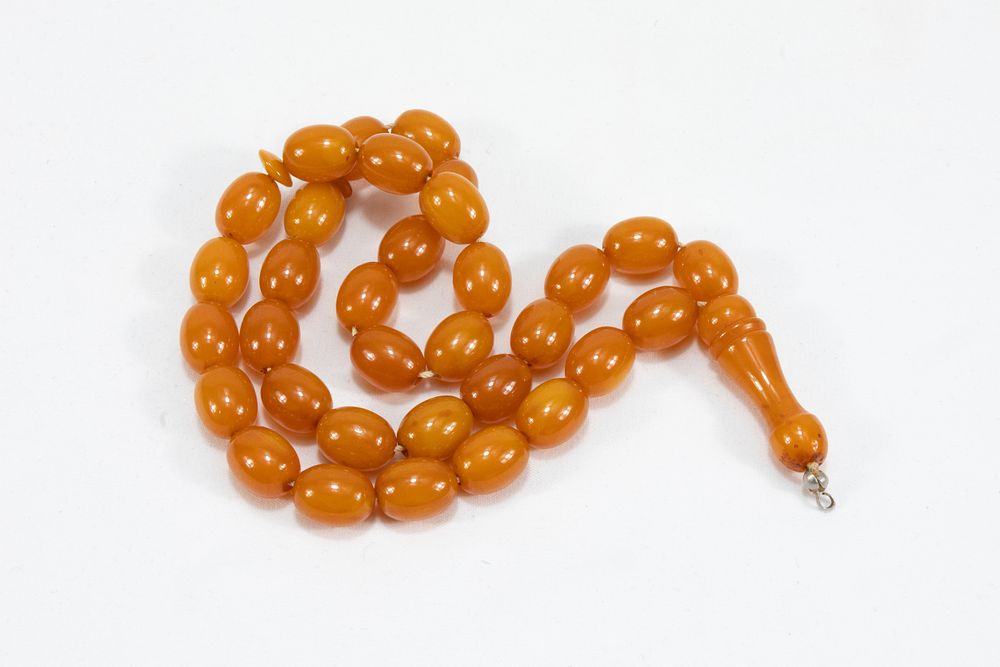 Lot 194: An Islamic Single Strand Butterscotch Amber Prayer Beads...
