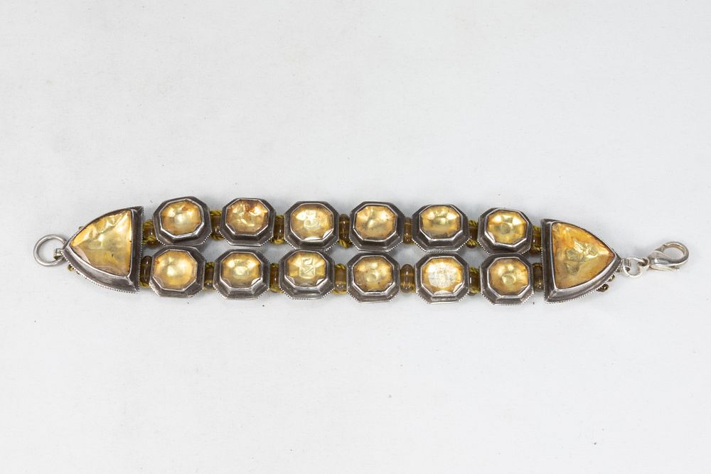 Lot 263: An Indian Silver Bracelet Decorated with Yellow Glass.