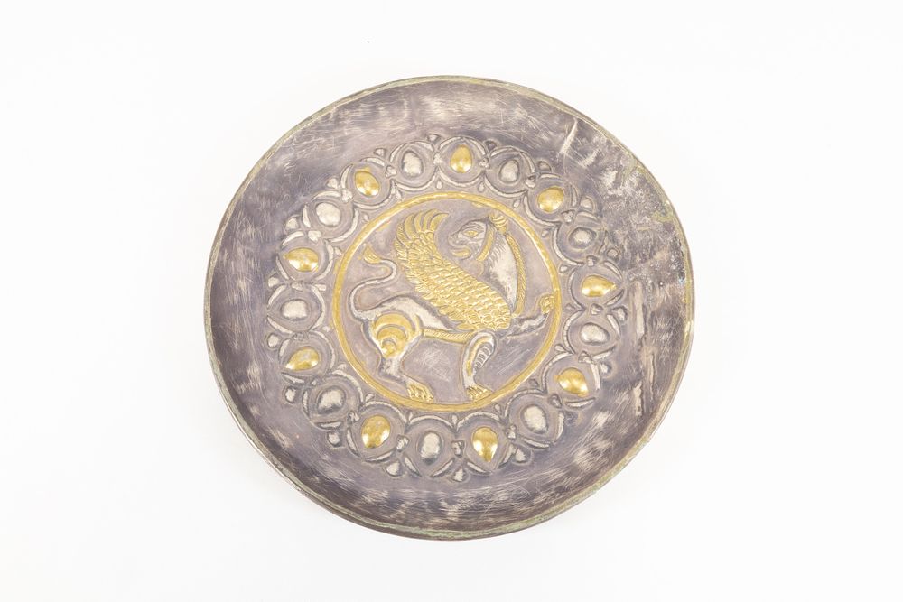 Lot 302: An Indo-Persian Silver Plate Decorated with Gold Gilt...