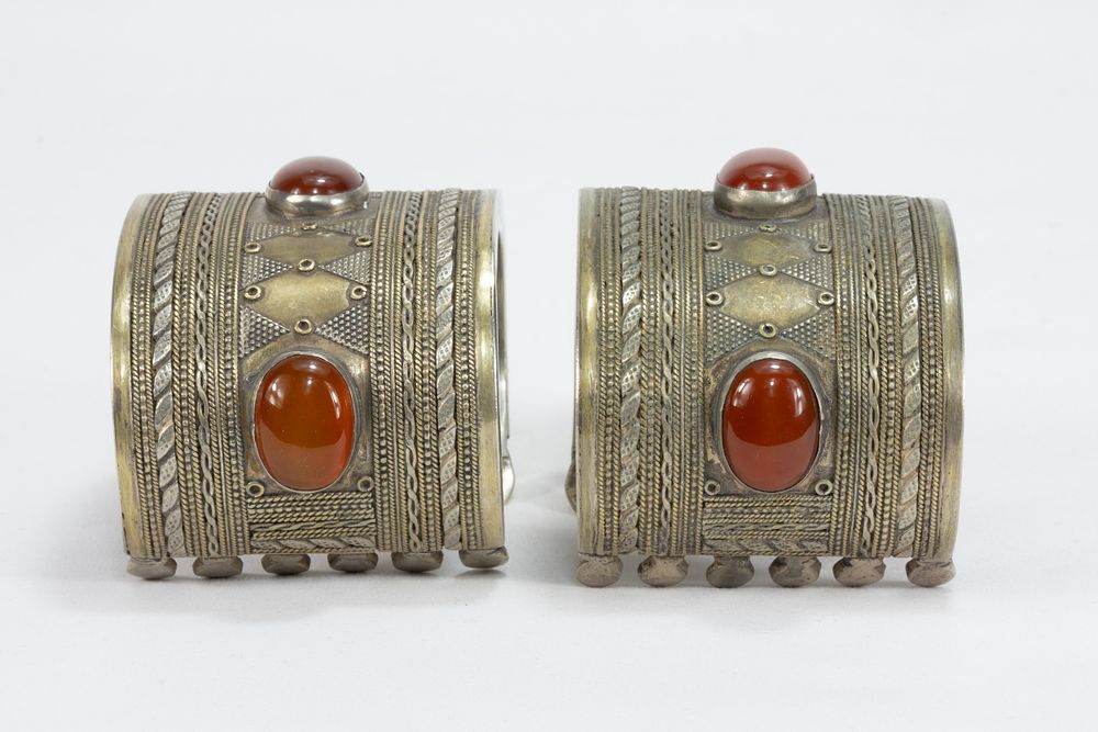 Lot 313: A Pair of Tribal Afghan White Metal Gilded...