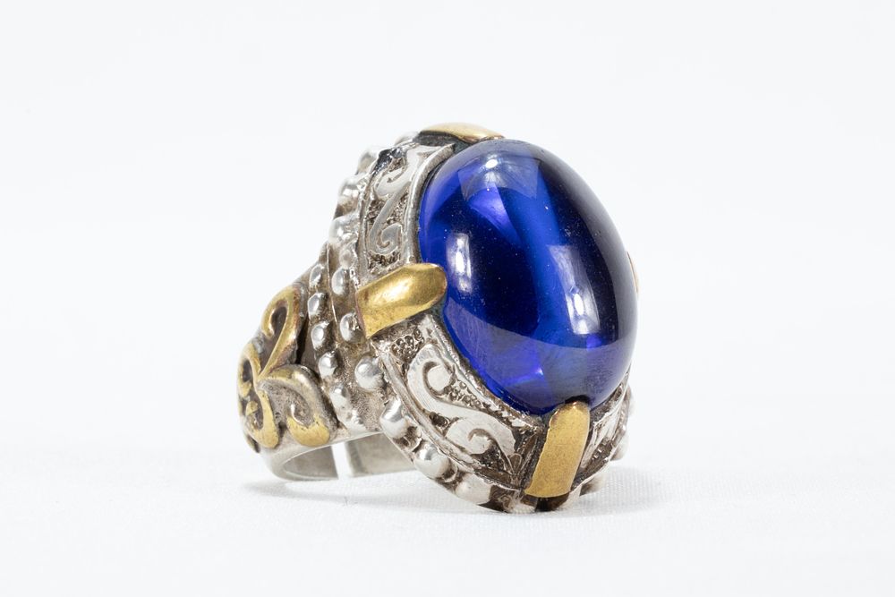 Lot 331: A Blue Gemstone Ring Set on Silver &...