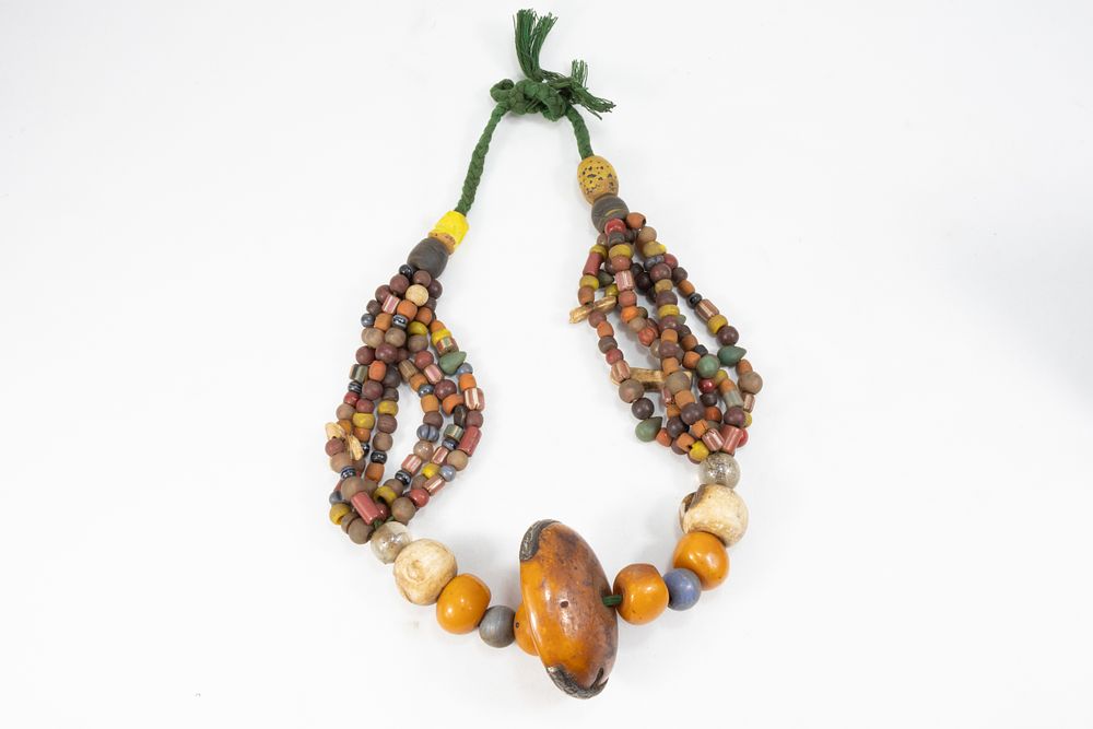 Lot 343: A Large Tribal Moroccan Amber Coloured Beads Necklace.