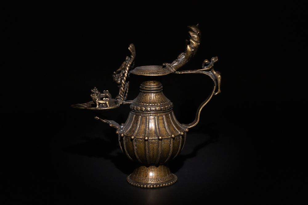Lot 87: An Indian Bronze Oil Lamp, Decorated with Mythical...