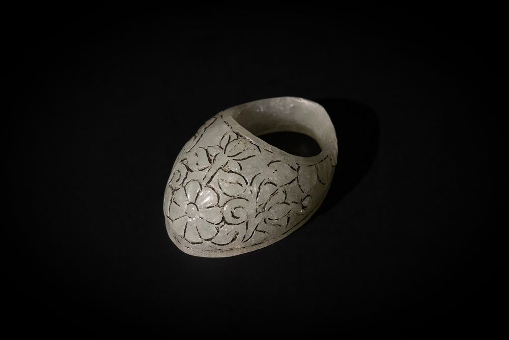 Lot 95: An Indian Jade Archer Ring Carved with Floral...