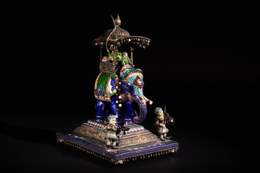 Lot 129: An Indian Polychrome Enamelled Elephant Howdah Figurine, 20th...