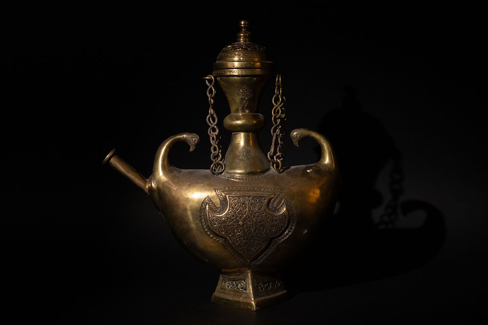 Lot 135: An Islamic Indian Bronze Ewer Decorated with Intricate...
