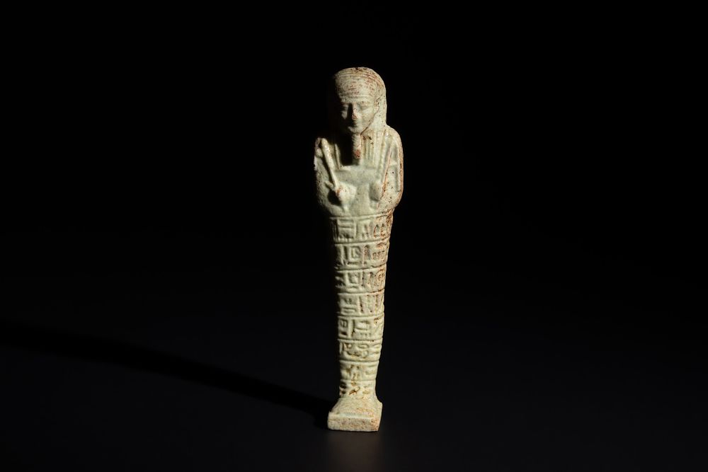 Lot 164: An Egyptian Faience Ushabti Circa 625 B.C. Inscribed...