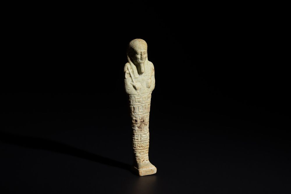 Lot 165: An Egyptian Faience Ushabti Circa 625 B.C. Inscribed...