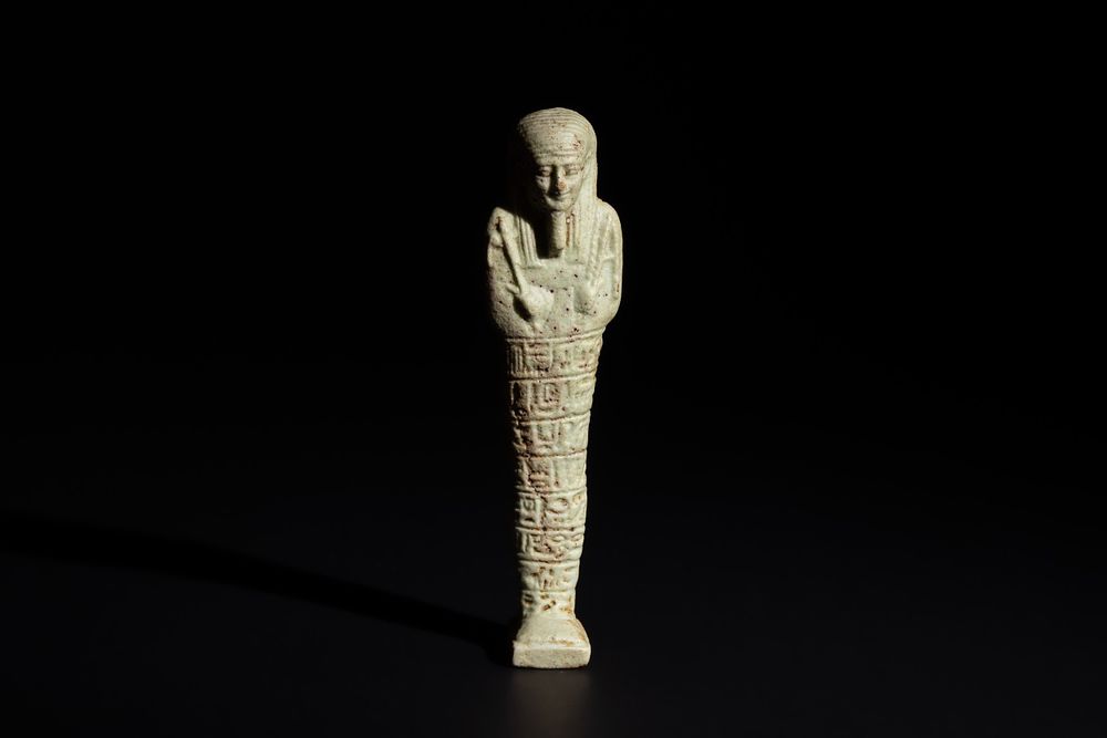 Lot 166: An Egyptian Faience Ushabti Circa 625 B.C. Inscribed...