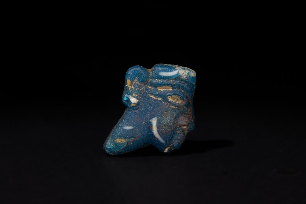 Lot 188: An Egyptian Glass Face Inlay, Circa 400 B.C.-300...