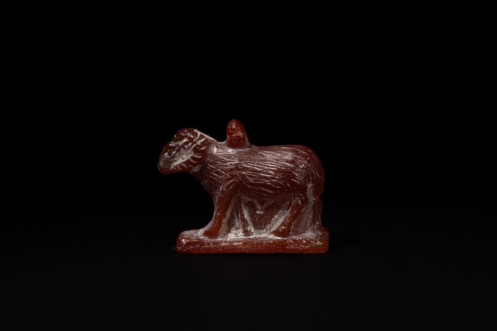 Lot 189: An Egyptian Carnelian/ Agate Amulet of a Standing...