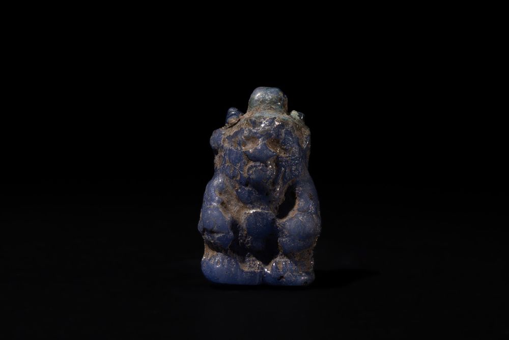 Lot 196: An Egyptian Glass Figure of "Bes", Symbol of...