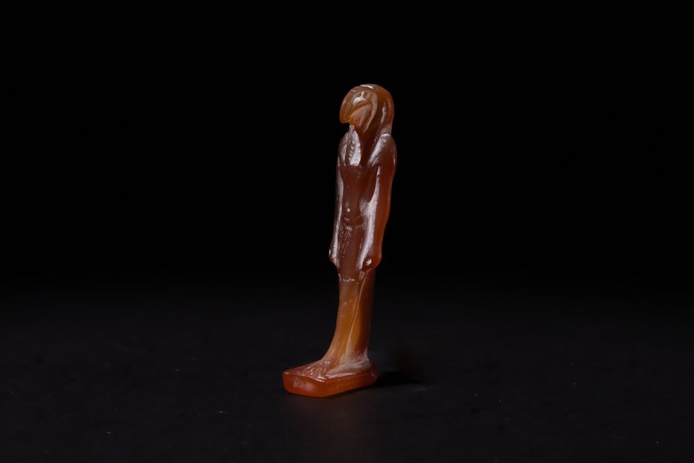 Lot 197: An Egyptian Agate Amulet of a Standing Figure...