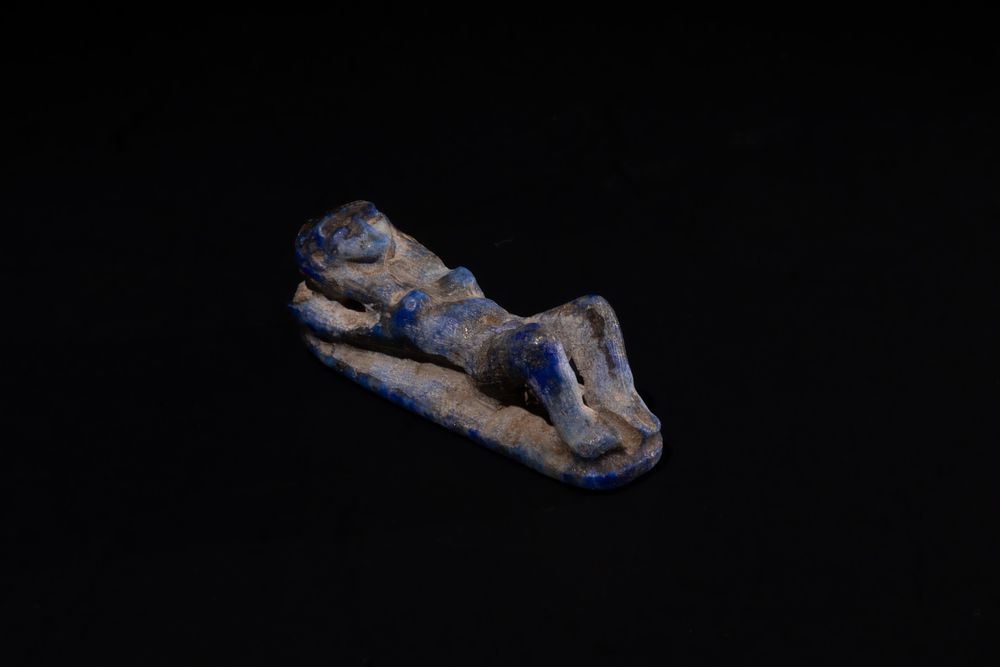 Lot 201: An Egyptian Lapis Lazuli Reclining Naked Woman in...