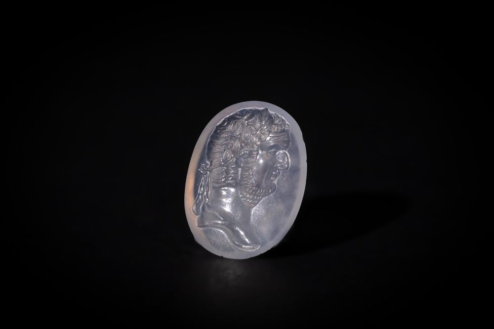Lot 225: A Chalcedony Crystal Intaglio, Probably Roman Vespasian.