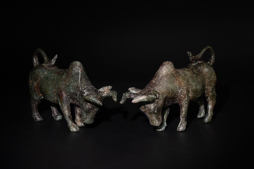 Lot 232: A Pair of Greek Roman Bronze Charging Bulls,...