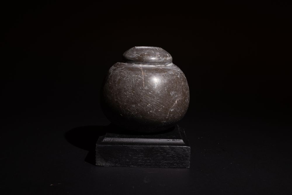 Lot 240: A Western Asiatic Black Hardstone Spherical Ceremonial Macehead,...